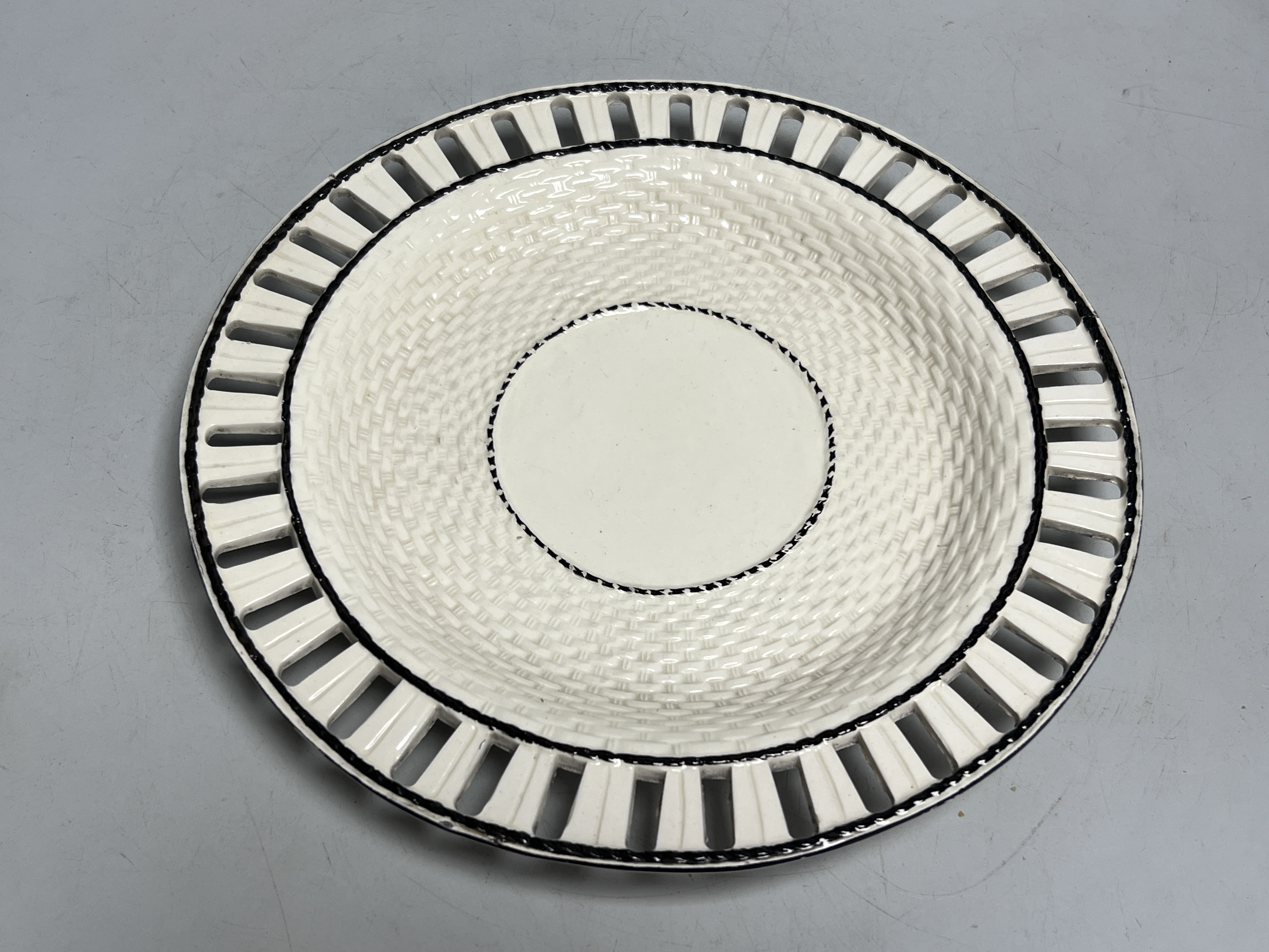An early 19th century creamware chestnut basket and stand, 24cm